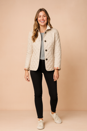Khaki quilted button-down jacket with diamond pattern stitching, front pockets, and classic collar, styled for a modern winter look.