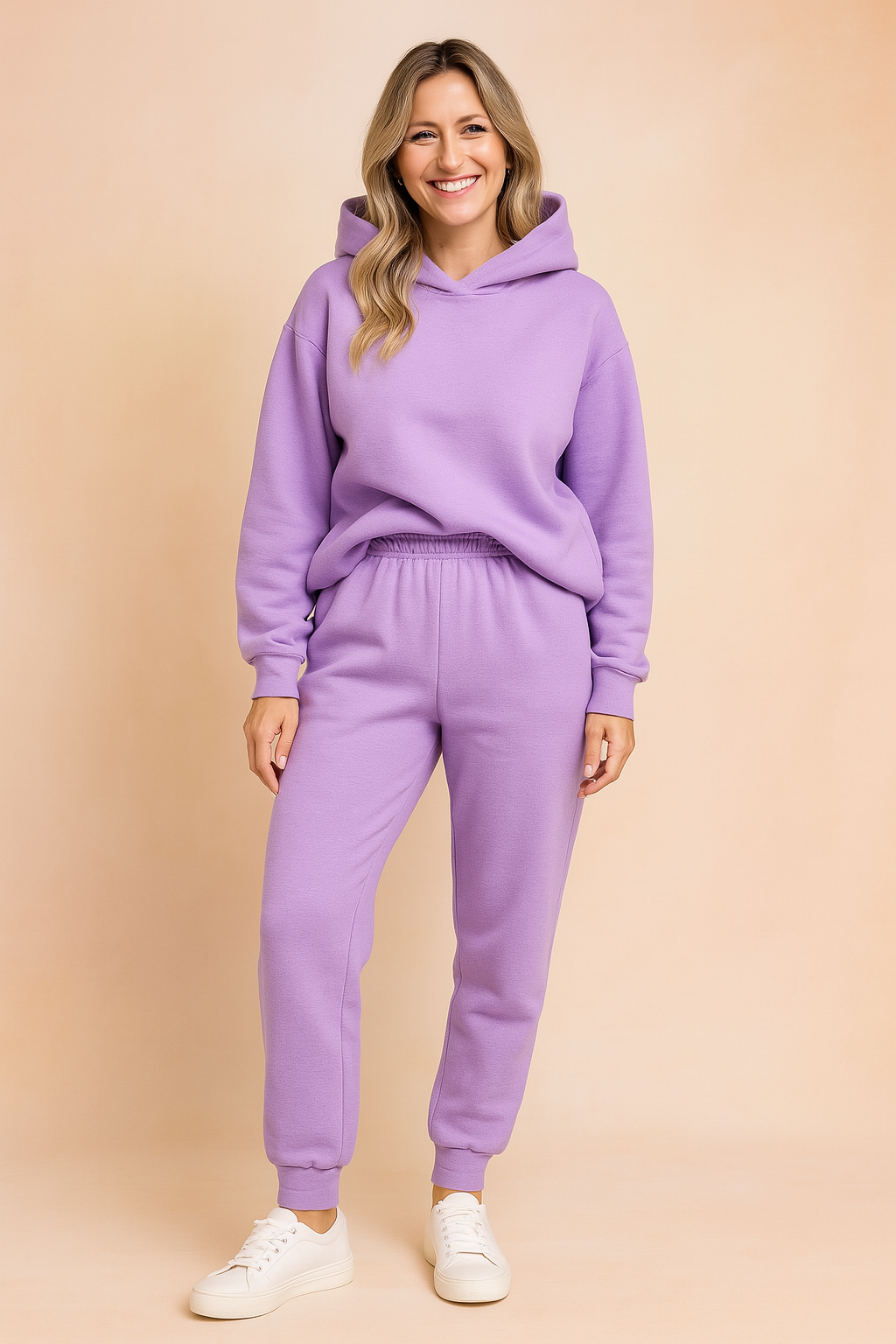 Lavender fleece loungewear set consisting of a cozy hooded sweatshirt with a slightly oversized fit and elastic-waist jogger pants, paired with minimalist white sneakers for a soft casual look.

