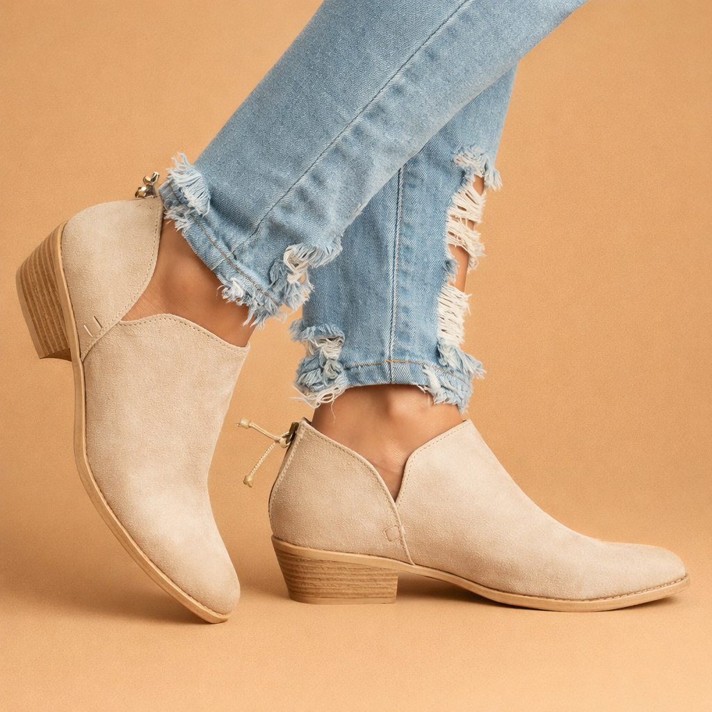 leather-ankle-boots-warm-sand-studio-model-pose.png