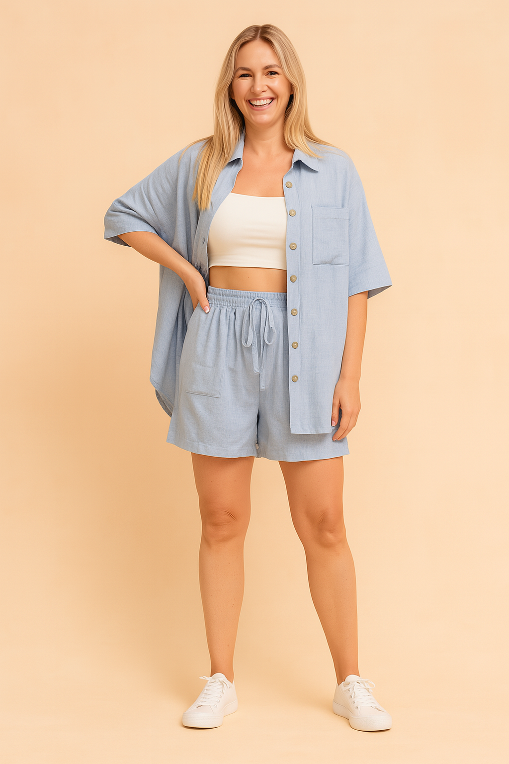 Relaxed-fit light blue two-piece coords featuring a short-sleeve button-down shirt with a chest pocket and matching high-waisted drawstring shorts; both pieces crafted from a smooth woven fabric with a consistent soft texture and subtle heathered finish, accurately reflecting the original pattern and shade.
