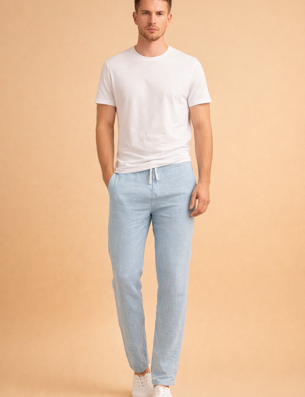 Light blue linen drawstring trousers with a straight slim leg, lightweight breathable fabric, smooth weave texture, clean waistband with adjustable tie, ankle-length cut, paired with minimalist white low-top sneakers.