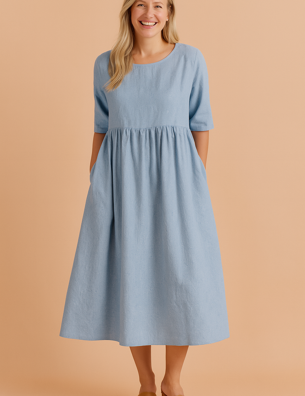 Light blue midi dress with elbow-length sleeves, gathered empire waist, subtle textured weave, side pockets, and soft A-line silhouette.