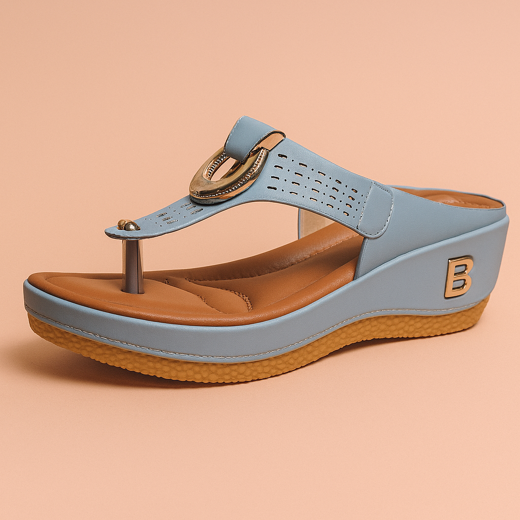 Light blue wedge sandal with gold ring accent, perforated strap, cushioned tan insole, caramel-textured sole, and a metallic "B" logo on the heel side.