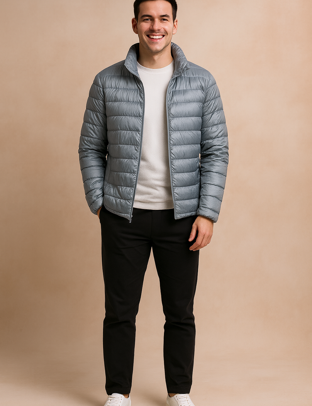 Light gray puffer jacket with horizontal quilted design and front zipper, styled with a white t-shirt, black trousers, and white sneakers.
