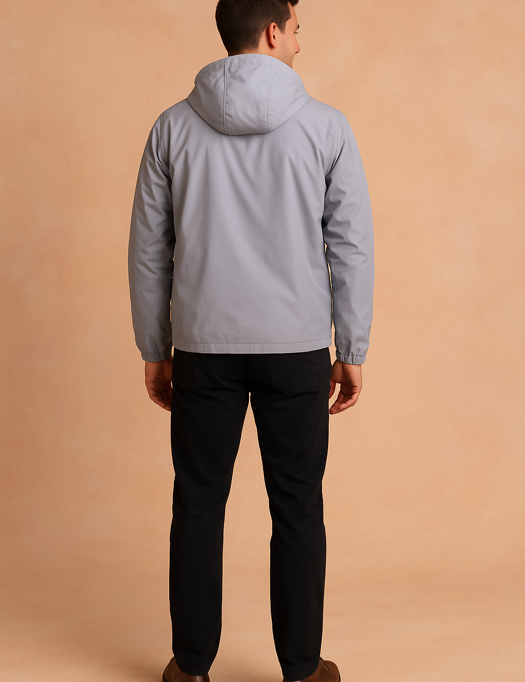 Back view of a light grey hooded windbreaker jacket with clean stitching and elastic cuffs, styled in a modern slim casual fit.