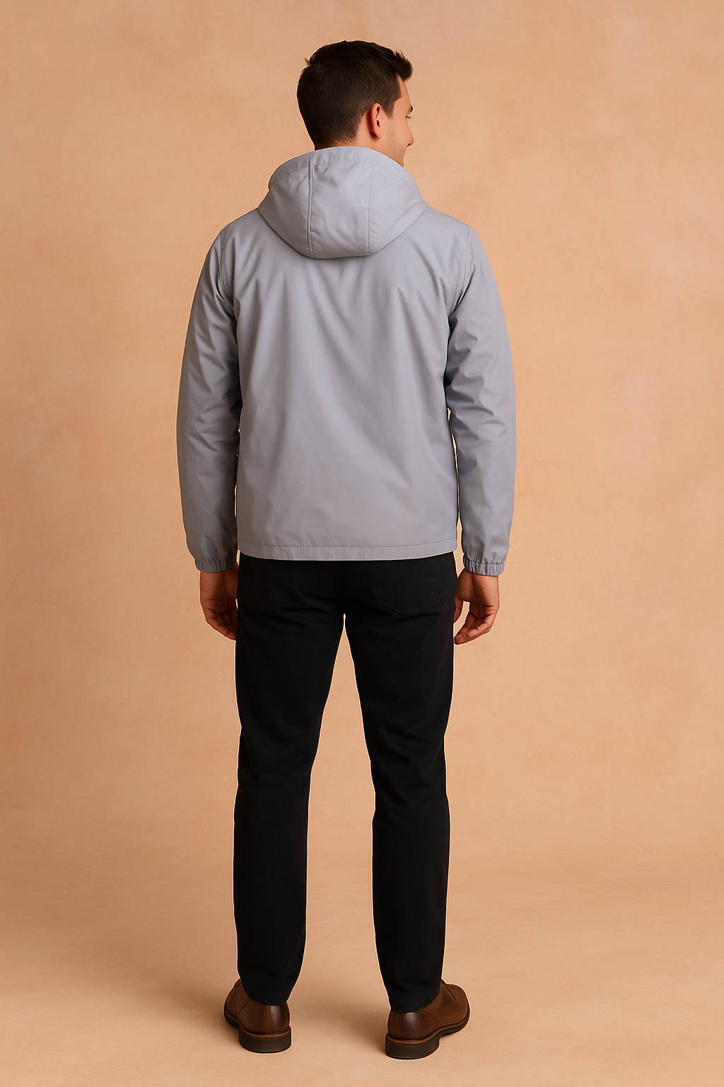 Back view of a light grey hooded windbreaker jacket with clean stitching and elastic cuffs, styled in a modern slim casual fit.