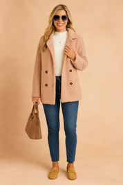 Women's double-breasted teddy coat in light beige with textured fleece fabric, button-down front, and relaxed fit for cozy winter layering