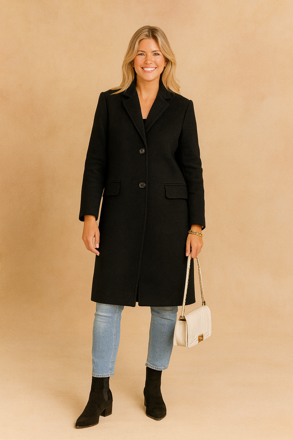 Chic long black tailored coat with button closure and flap pockets, styled with slim-fit denim jeans for a modern minimalist look.