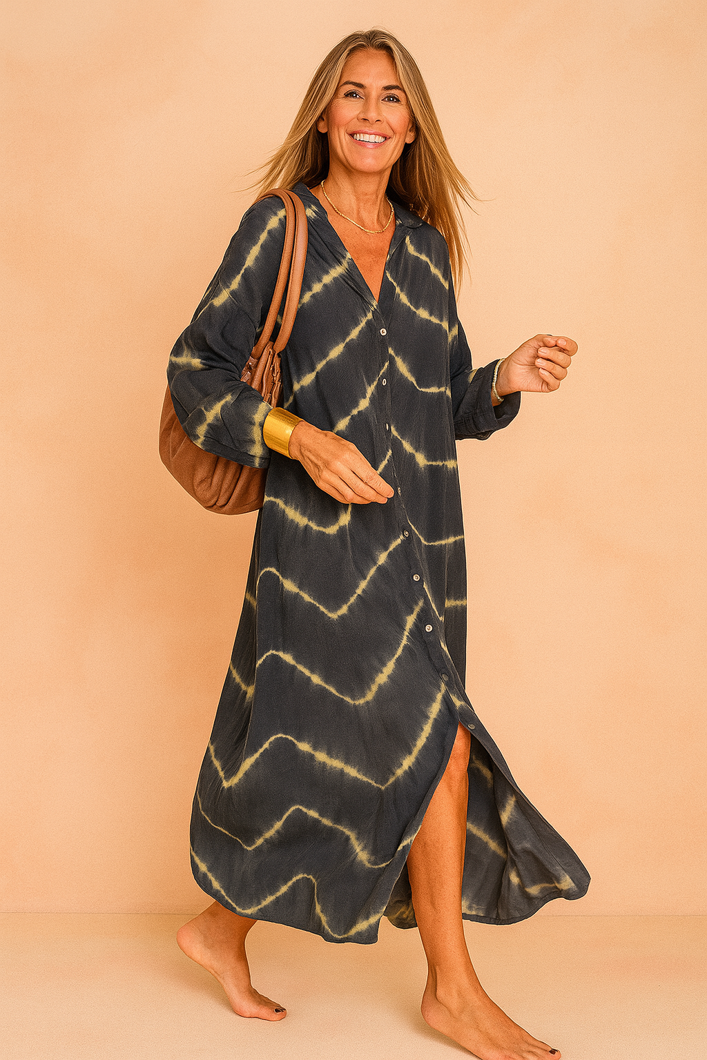 Confident European woman in a loose black and beige tie-dye maxi shirt dress with buttons.