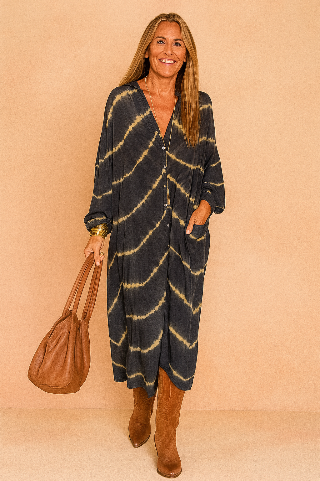Confident European woman in a loose black and beige tie-dye maxi shirt dress with buttons.