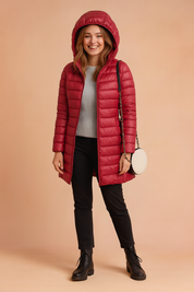 Women's maroon long puffer jacket with hood, quilted pattern, zip closure, and mid-thigh length for winter wear