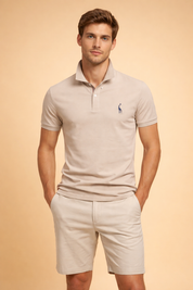 Slim-fit short-sleeve polo top with a structured collar, clean button placket, subtle chest embroidery, and a smooth tailored finish paired with straight-cut chino shorts for a refined casual look.