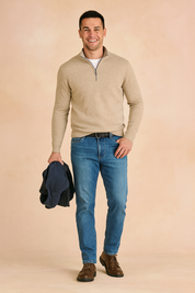 Men's beige quarter-zip sweater with ribbed texture, long sleeves, and lightweight knit design, styled with casual jeans for a modern and versatile look.