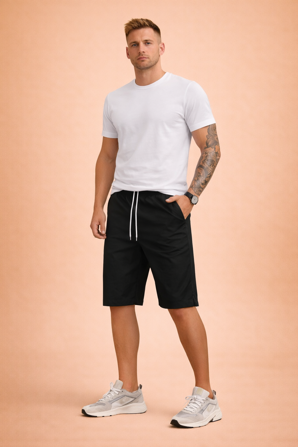 Men’s solid black casual shorts with elastic waistband and white drawstring, crafted from smooth lightweight fabric with a clean matte finish, paired with a classic heather grey short-sleeve cotton T-shirt featuring a fine jersey knit texture and neutral tone for everyday comfort.