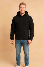 Men’s black fleece zip-up hooded jacket with multiple zip pockets and durable fabric, styled casually with jeans and sneakers