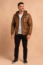 Men’s brown faux leather jacket with detachable hoodie, ribbed cuffs, zippered chest and side pockets, and casual slim-fit design.
