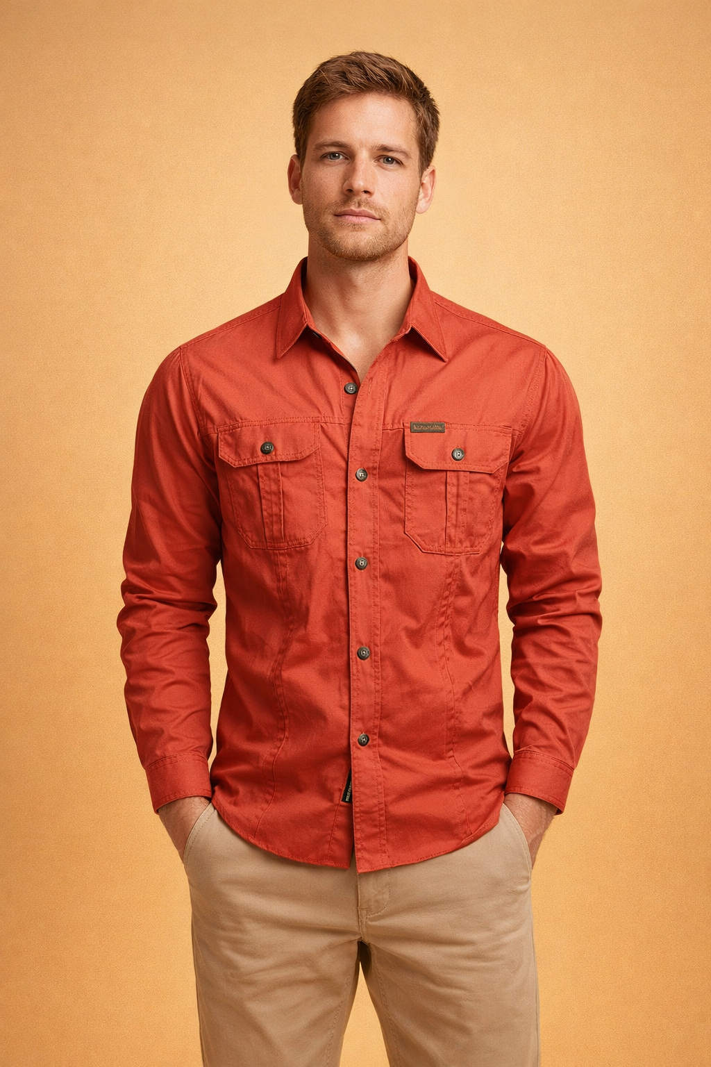 Long-sleeve button-up shirt with a structured collar, full front button closure, and two symmetrical chest flap pockets with button fastenings, paired with straight-leg tailored trousers for a clean, modern casual look.