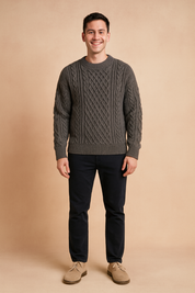 Charcoal gray cable-knit sweater for men with intricate diamond and braided patterns, designed for a stylish winter look.