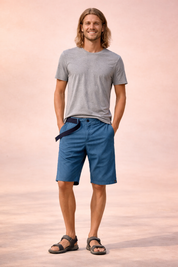 Men’s lightweight outdoor shorts in deep blue with a fine micro-check woven texture, breathable fabric construction, mid-thigh straight cut, zip fly with single button closure, integrated black webbing belt, clean finished hem, and durable casual utility design.