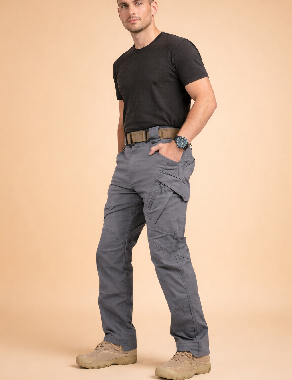 Men’s grey tactical cargo pants with straight-leg cut, reinforced seam panels, multi-functional side pockets with flap and zipper details, structured waistband with belt loops, and durable utilitarian design suitable for everyday wear.