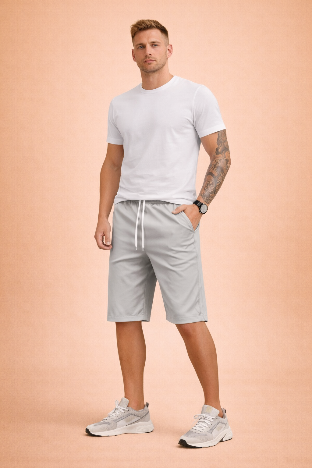Men’s light grey casual summer shorts crafted from smooth woven cotton fabric with a matte finish, featuring a solid uniform grey tone, elastic waistband with white drawstring, relaxed straight-leg cut above the knee, clean stitched hems, and a minimal unpatterned surface with natural fabric folds.