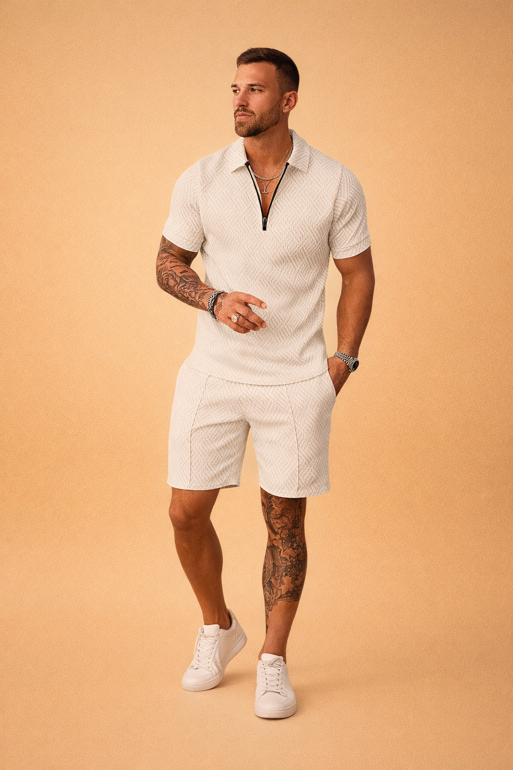 Luxury men’s summer two-piece outfit featuring a light grey short-sleeve polo shirt and matching tailored shorts, crafted from textured jacquard fabric with a refined geometric pattern, zip-neck polo collar, clean hem finishes, and a coordinated all-over print with consistent color tone and fabric structure.