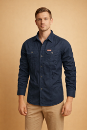 Long-sleeve navy button-down shirt with structured collar, front button closure, dual flap chest pockets, reinforced seams, and tailored fit, paired with straight-cut beige chinos for a clean, modern menswear look.