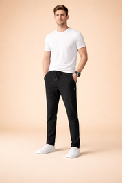 Minimalist white short-sleeve T-shirt paired with slim-fit black drawstring pants featuring a tapered leg, clean seam lines, and a smooth drape, styled with low-profile white sneakers for a modern casual look.