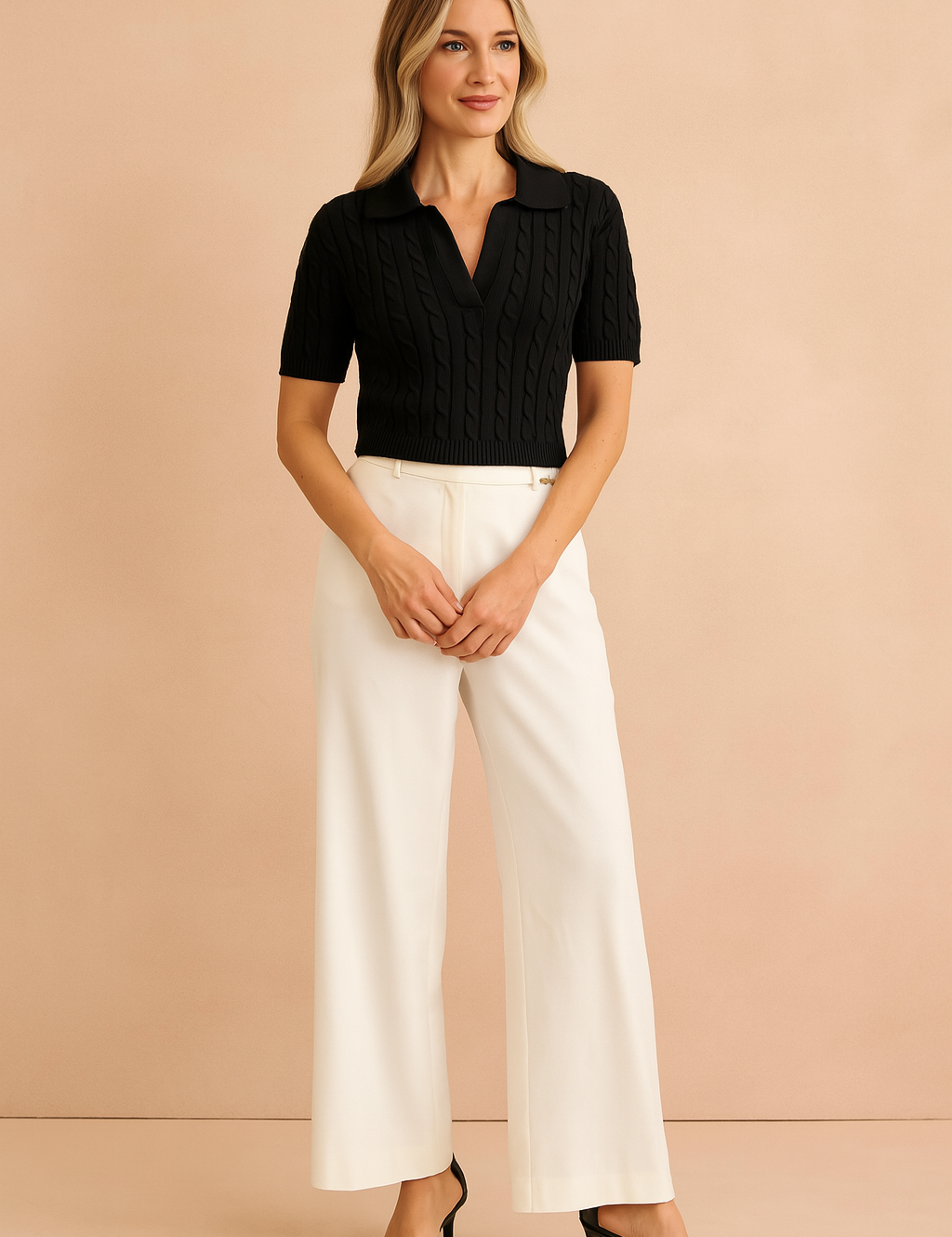 Black cable-knit short sleeve polo top paired with tailored wide-leg ivory trousers and black heeled sandals, styled in a chic and modern fashion.