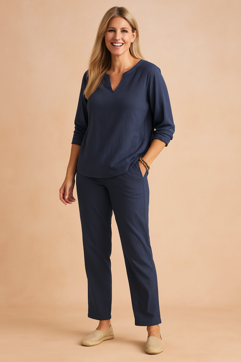 Alt Text:
Relaxed-fit navy blue long-sleeve top paired with matching navy blue straight-leg pants, both crafted in lightweight textured fabric with subtle crinkle detailing for a breezy and casual yet polished look.