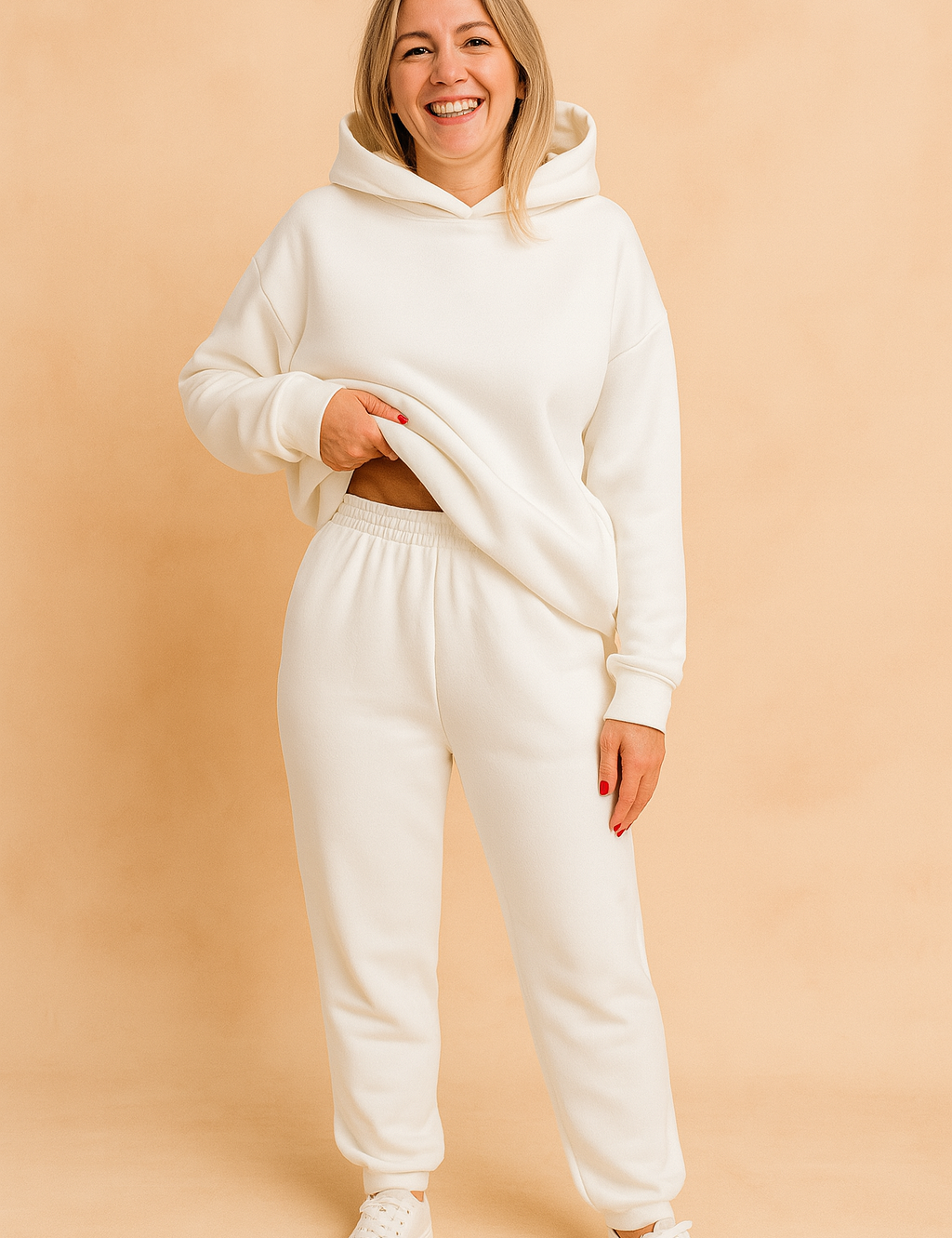 Women's white fleece hoodie and sweatpants set featuring a relaxed oversized fit, ribbed cuffs, and an elastic waistband, perfect for cozy loungewear or casual daywear