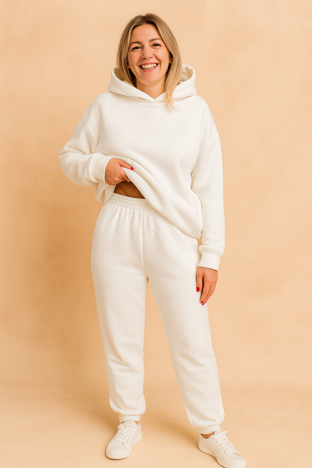 Women's white fleece hoodie and sweatpants set featuring a relaxed oversized fit, ribbed cuffs, and an elastic waistband, perfect for cozy loungewear or casual daywear