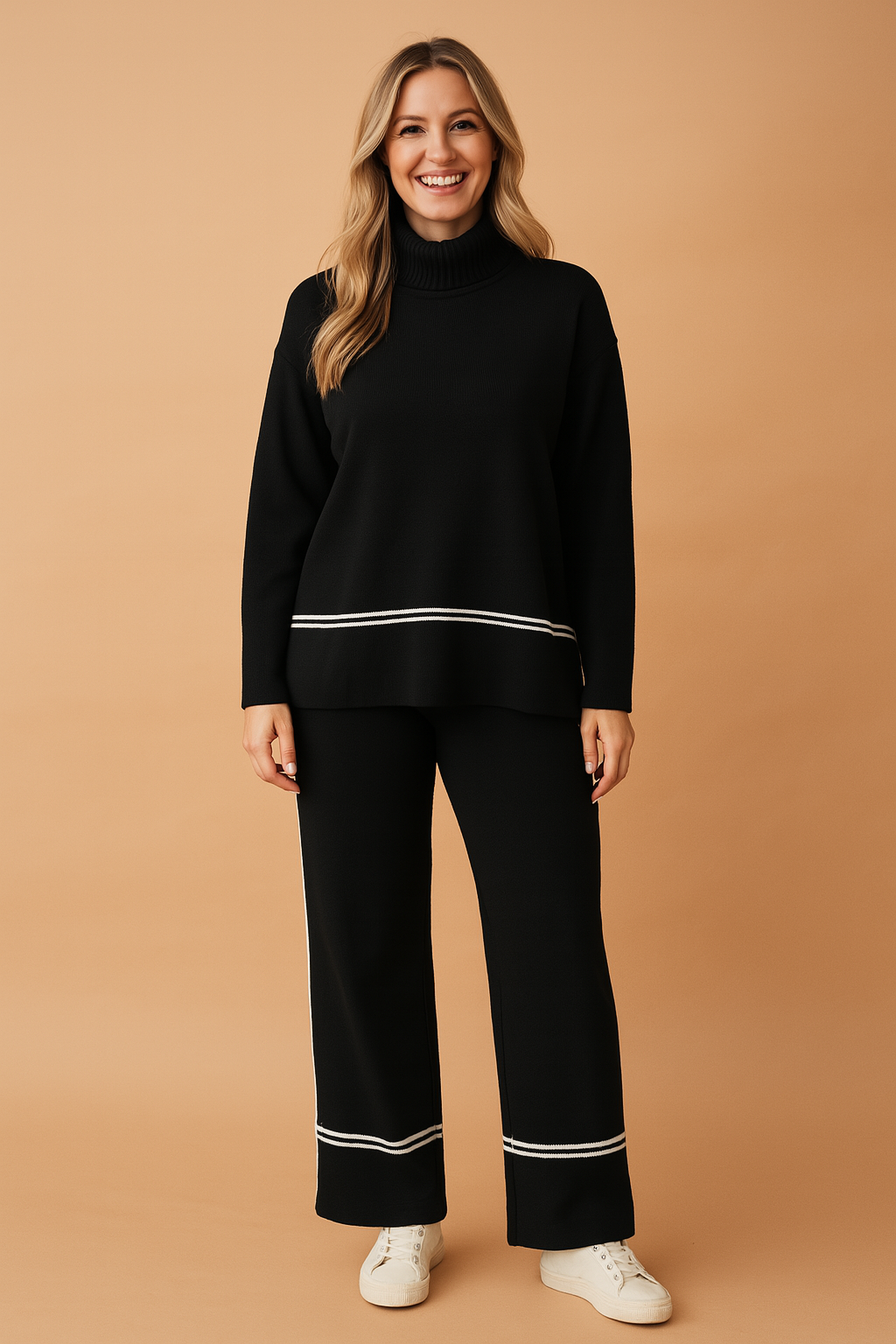 Black knit two-piece set featuring a long-sleeve top with a high extended ribbed collar and a white contrast stripe above the hem, paired with matching straight-leg pants accented by white contrast trim near the cuffs.