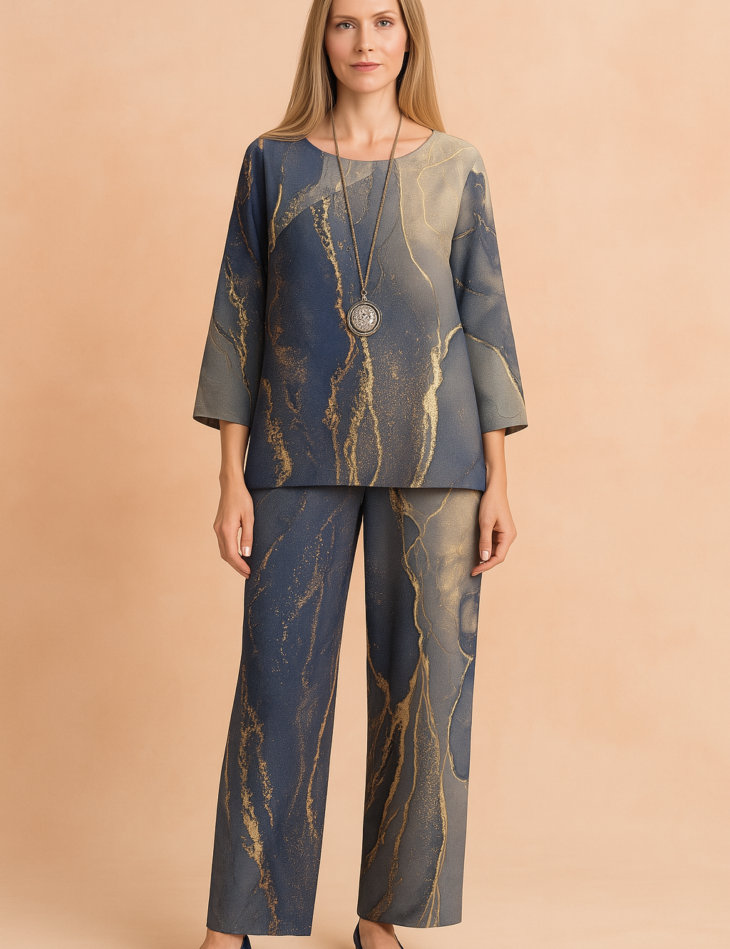 Two-piece loungewear set with abstract navy, grey, and gold marble print, featuring a relaxed-fit long-sleeve blouse and matching wide-leg pants in soft, lightweight fabric.