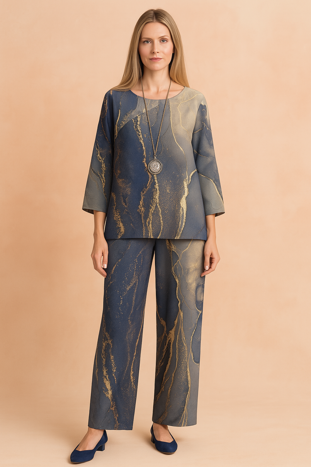 Two-piece loungewear set with abstract navy, grey, and gold marble print, featuring a relaxed-fit long-sleeve blouse and matching wide-leg pants in soft, lightweight fabric.
