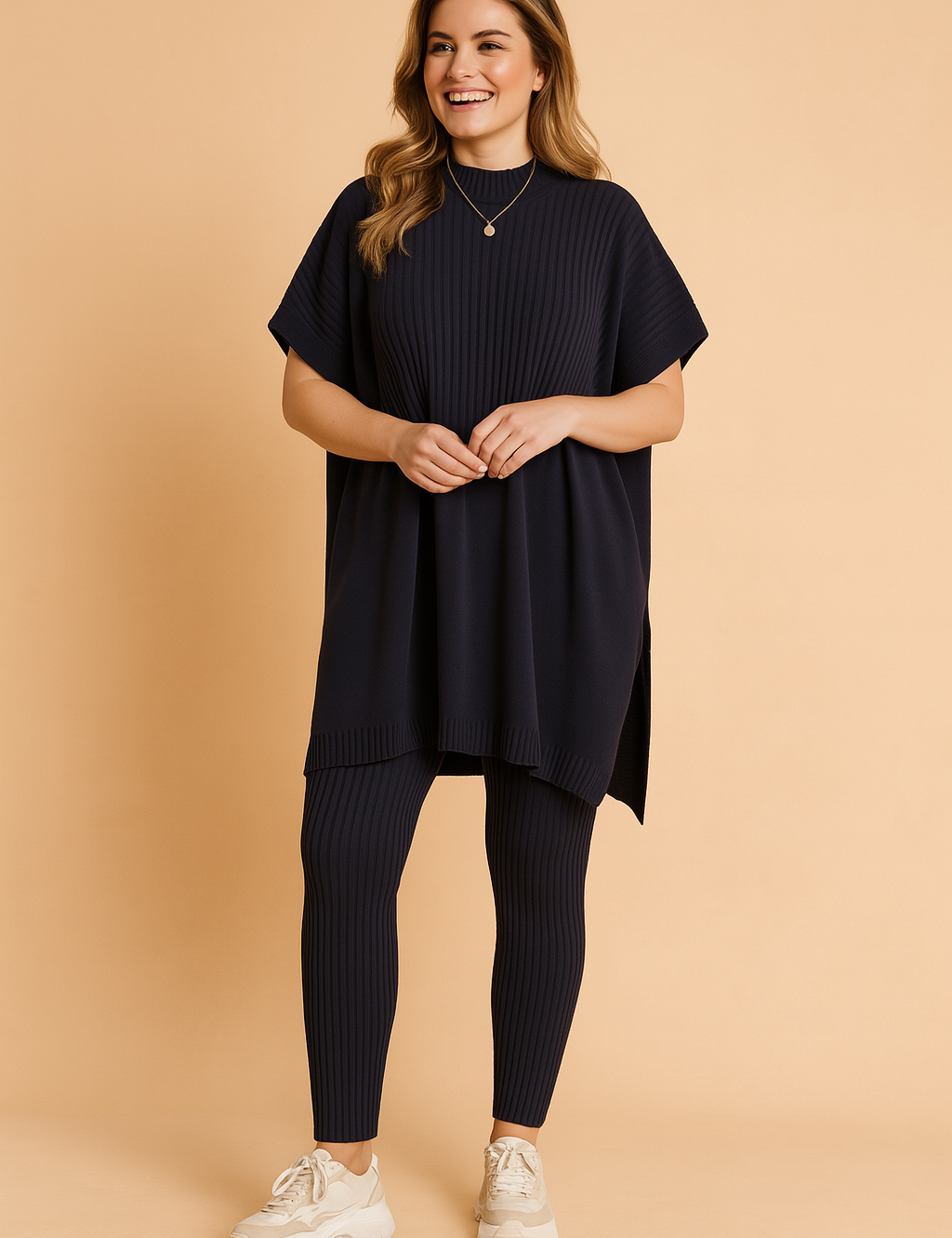 Two-piece navy ribbed knit set featuring an oversized short-sleeve tunic top with vertical texture detailing, paired with matching fitted ribbed leggings.