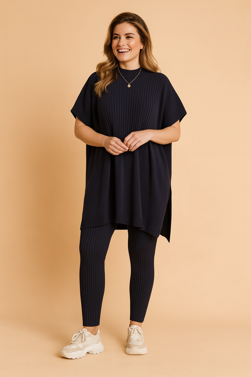 Two-piece navy ribbed knit set featuring an oversized short-sleeve tunic top with vertical texture detailing, paired with matching fitted ribbed leggings.