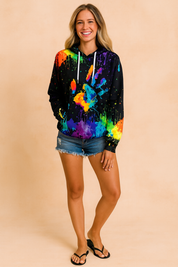 Black hoodie with large multicolored handprint and paint splatter design, paired with distressed blue denim shorts and black flip-flop sandals.