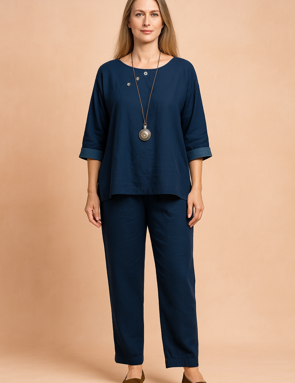 Navy blue linen two-piece set featuring a boat-neck top with three decorative silver buttons and cuffed sleeves, paired with straight-leg ankle-length pants.