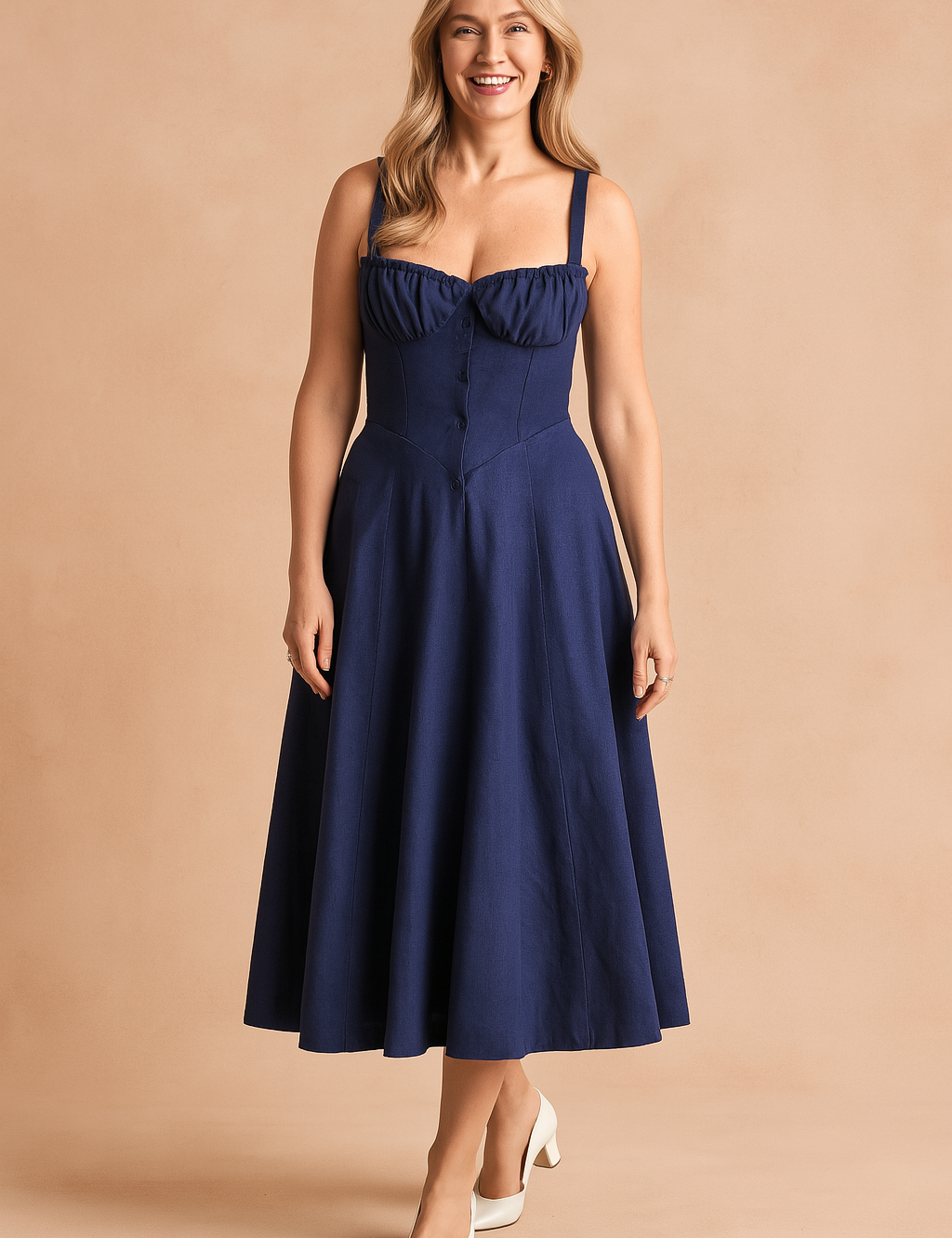 Elegant navy blue midi dress featuring a structured corset-style bodice, gathered sweetheart neckline, and wide straps, finished with a flowy A-line skirt and tonal button front closure for a timeless silhouette.
