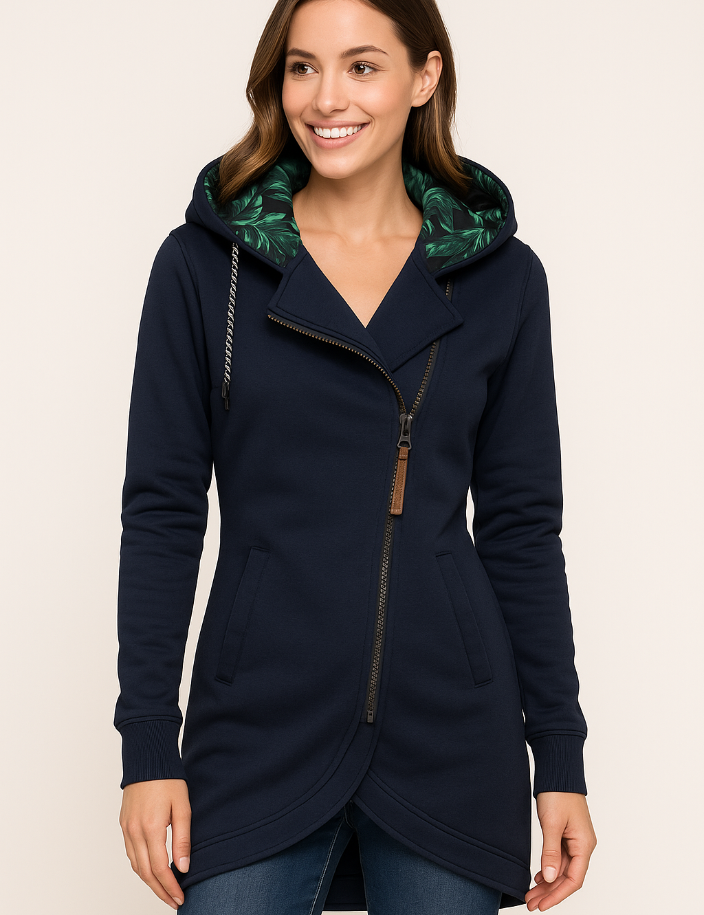 Women's navy zip hoodie with tropical leaf-lined hood, curved hem, and leather zipper pull, styled with ribbed cuffs and welt pockets.