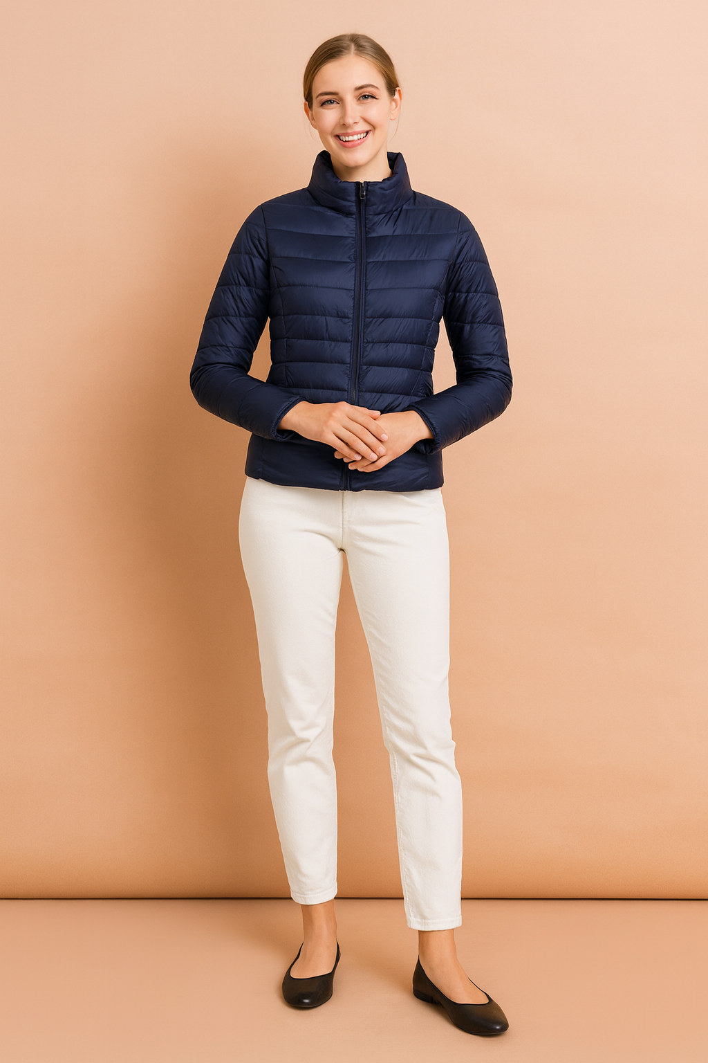 Women’s navy blue quilted puffer jacket with horizontal stitching, high collar, and front zip closure, styled with a slim fit
