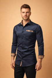 Tailored navy long-sleeve button-down shirt with contrast plaid inner collar, matching plaid cuff accents, single chest pocket, slim fit cut, and clean front button closure.
