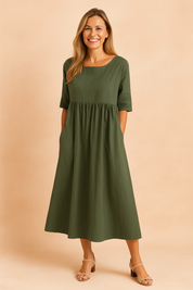 Olive green linen midi dress with elbow-length sleeves, gathered waist, A-line silhouette, and discreet side pockets.