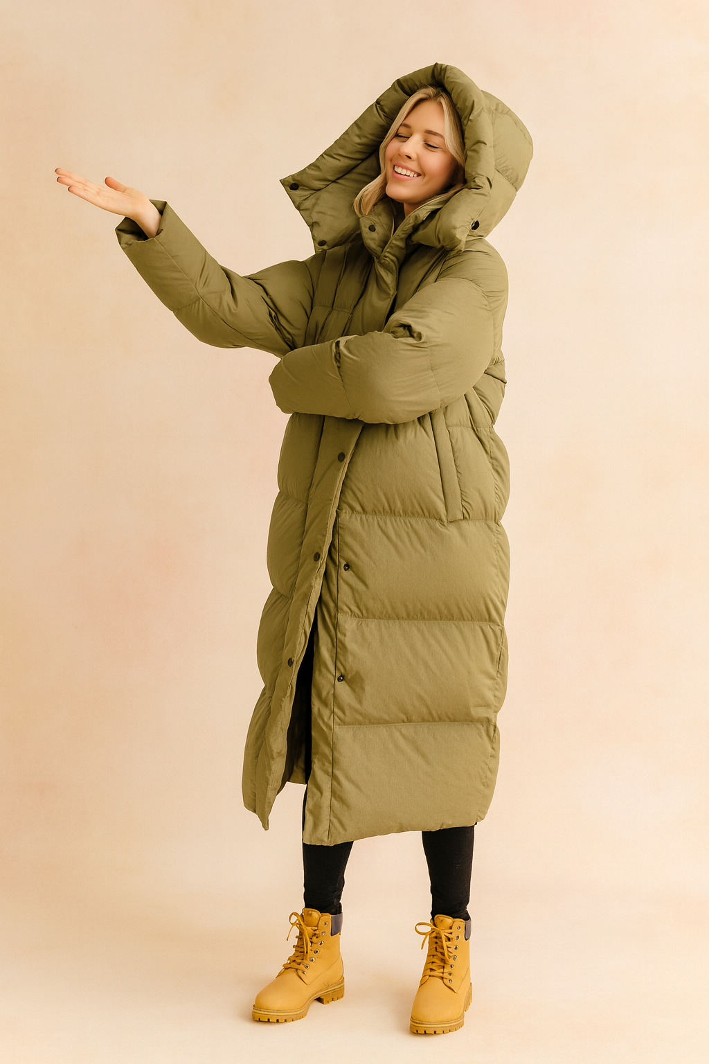 Long olive green puffer down winter jacket with hood, front button closure, and mid-calf length design for maximum warmth and comfort.