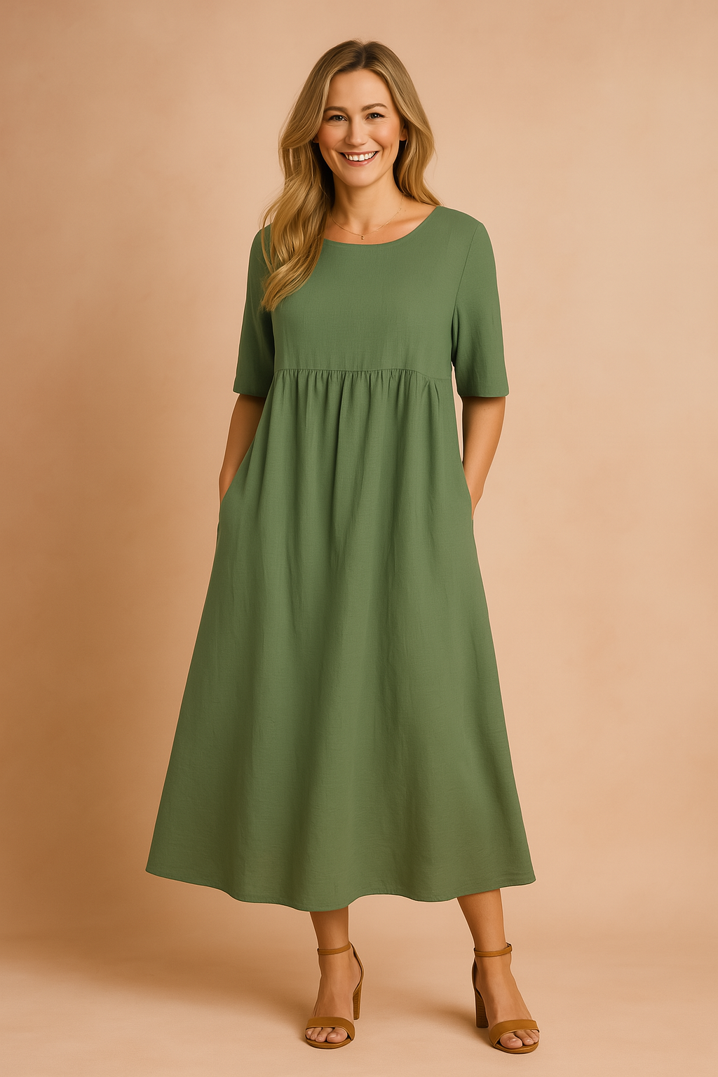 Olive green midi dress with short sleeves, a round neckline, and a gathered waistline, designed with a relaxed A-line silhouette and discreet side pockets, made from a lightweight woven fabric.