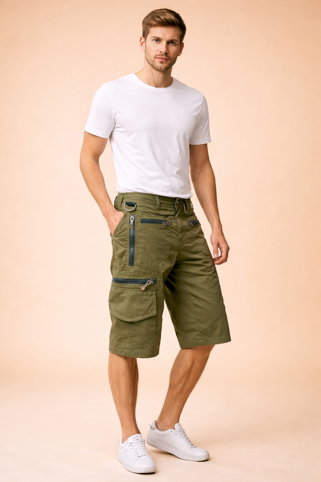 Olive green military-style cargo shorts with a structured cotton-blend fabric, featuring reinforced stitching, multiple utility pockets with metal zippers and flap closures, adjustable waistband detailing, and a straight knee-length cut, paired with a solid royal blue short-sleeve crew-neck T-shirt in smooth jersey cotton and clean white low-top athletic sneakers with layered mesh and rubber soles.