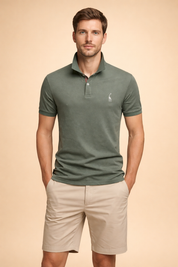 Classic olive green short-sleeve polo shirt with a structured collar, two-button placket, subtle embroidered chest logo, paired with tailored beige knee-length shorts featuring a clean front and relaxed fit.