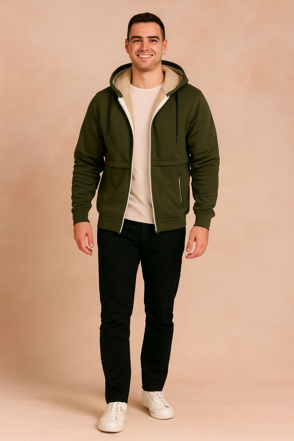 Olive green sherpa-lined zip-up hoodie with drawstring hood, ribbed cuffs, and front zipper details, styled with black trousers and white sneakers.
