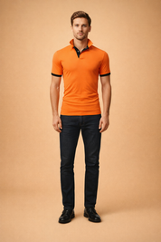 Modern slim fit orange polo shirt with contrast black collar and sleeve cuffs, smooth structured fabric, short sleeves, clean button placket, and tailored silhouette styled with minimal neutral leather shoes for a refined casual look